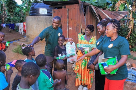 MRF staff distributing relief packages to a family in Greater Masaka